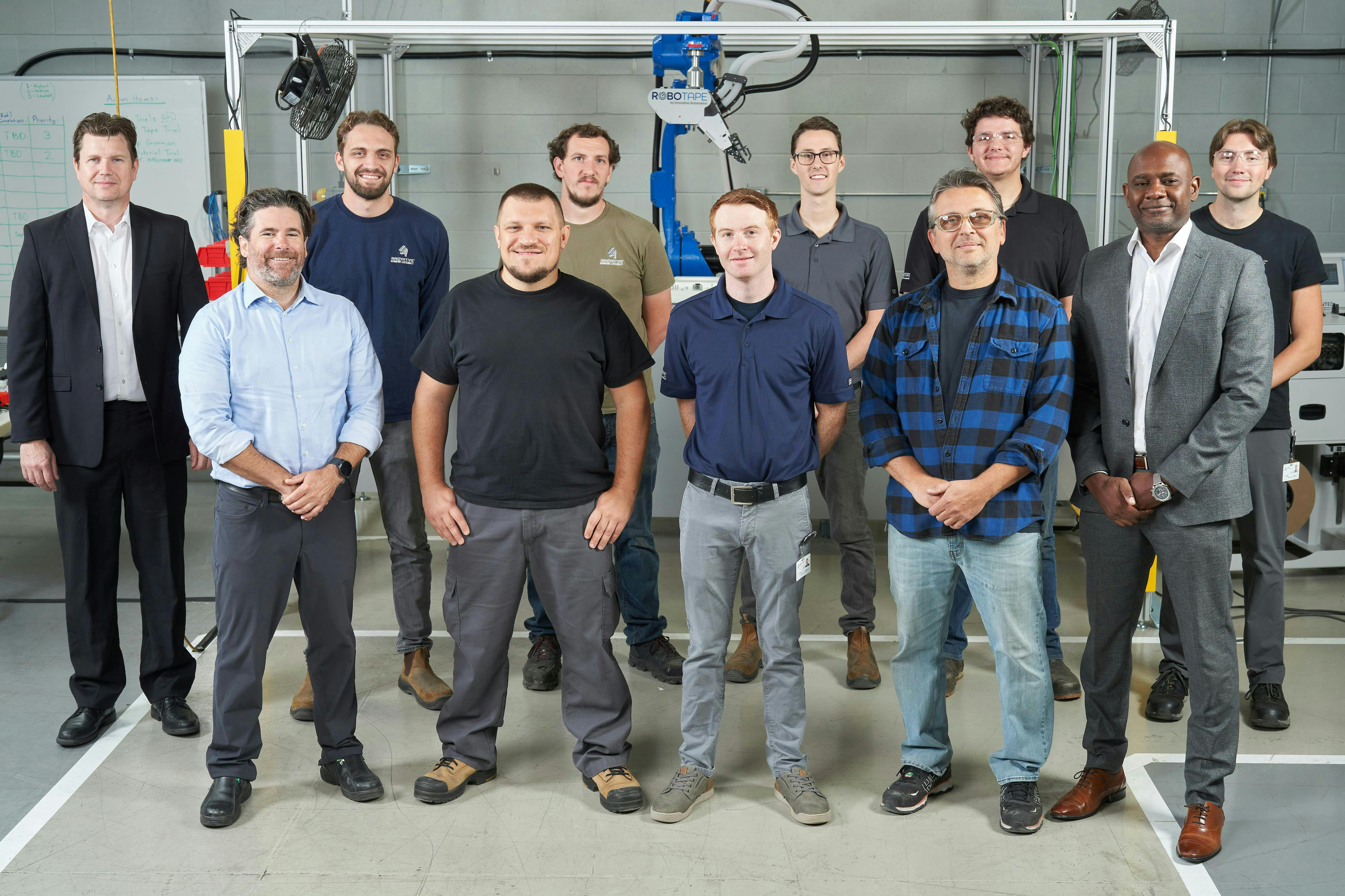 Figure 9: Jim Fallowfield, Beckhoff (back row, from left) with the Innovative Automation team of Josh Vander Doelen, Sean Wilson, Sean Robillard, Quinton Potts, Carter Metcalf, Michael Lalonde (front row, from left), Mike Likernyy, Zac Cutt, John Marinuzzo and Paul Pierre, Beckhoff, stick together at the RoboTape facility in Newmarket, Canada.