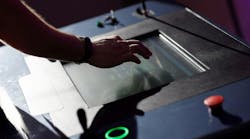 Operator working with HMI touch screen panel