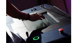 Operator working with HMI touch screen panel Operator working with HMI touch screen panel