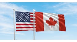 United States and Canada flags, two flags waving on sky background