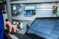 Programmer of PLC checks correct function of program Programmer of PLC checks correct function of program