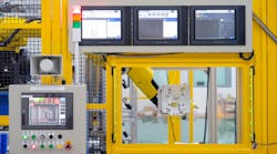 Factory 4.0 concept : View of operation panel and product inspection monitoring display on fence of manufacturing machine.