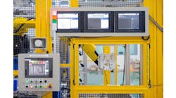 Factory 4.0 concept : View of operation panel and product inspection monitoring display on fence of manufacturing machine.