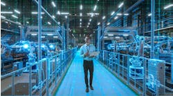 Engineer With Laptop Activates Autonomous EV Factory Digitization