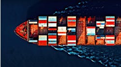 Aerial view of a cargo ship carrying colorful containers, cutting through deep blue waters with visible wave patterns. Aerial view of a cargo ship carrying colorful containers, cutting through deep blue waters with visible wave patterns.